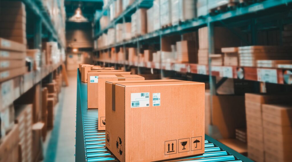 parcels on conveyor belt in a warehouse.